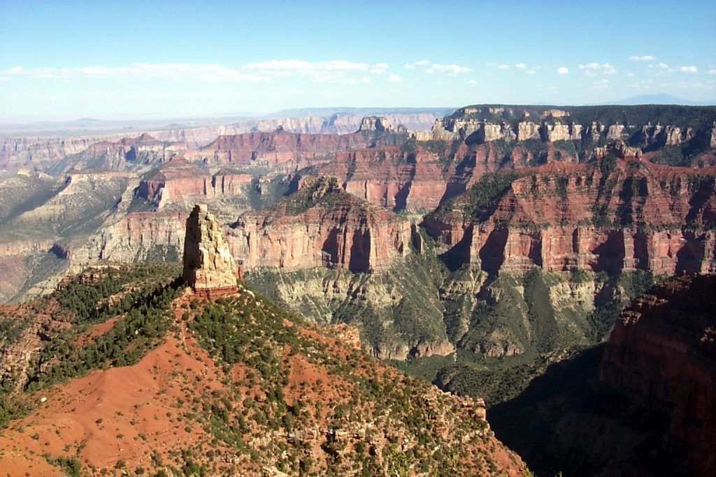 This picture shows why I like the North Rim best. First, the colours are more vivid and varied and second, many more features are visible and closer to the viewer. This photo is taken from Point Royal and looks south and a little east towards Desert View. You can see the step anticline along the southern rim (in the far distance) and the Painted Desert to the left.
