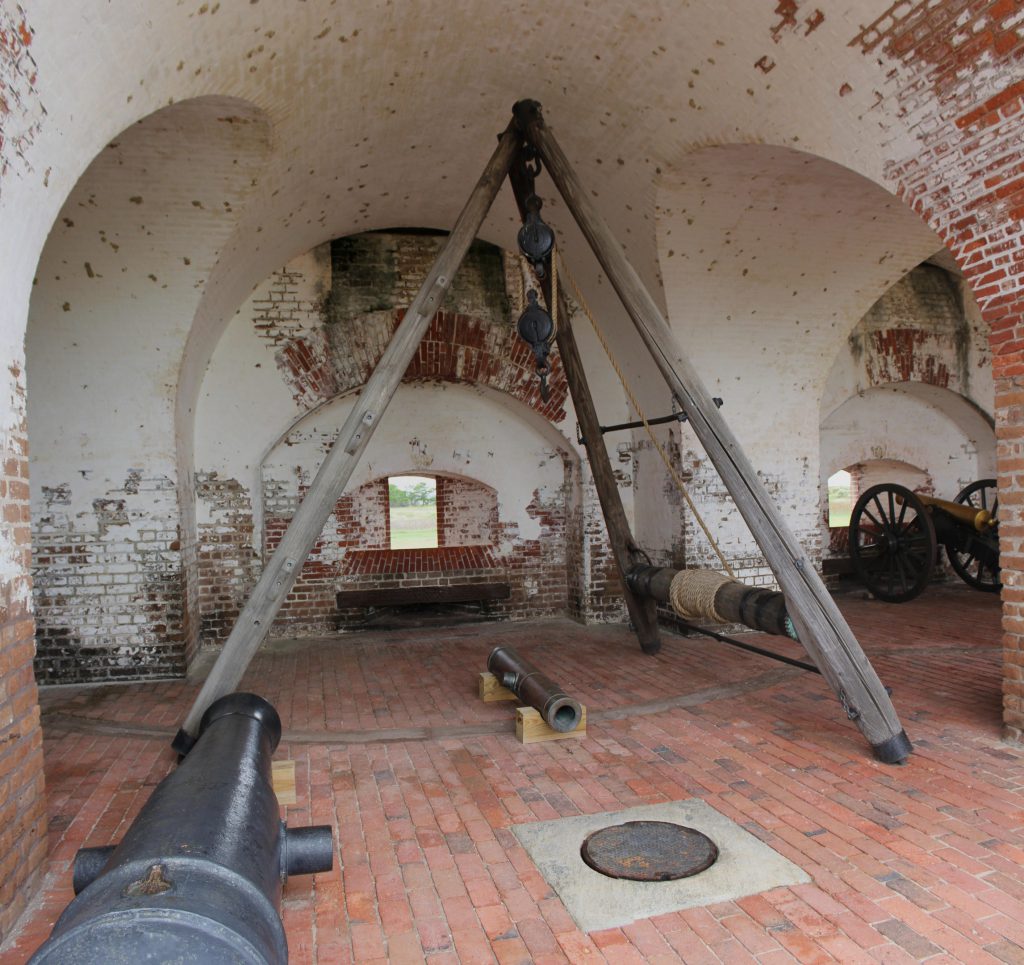 A cannon room with tripod and pulley system. The tripod/pulley system is used to lift cannon tubes onto their mounts.