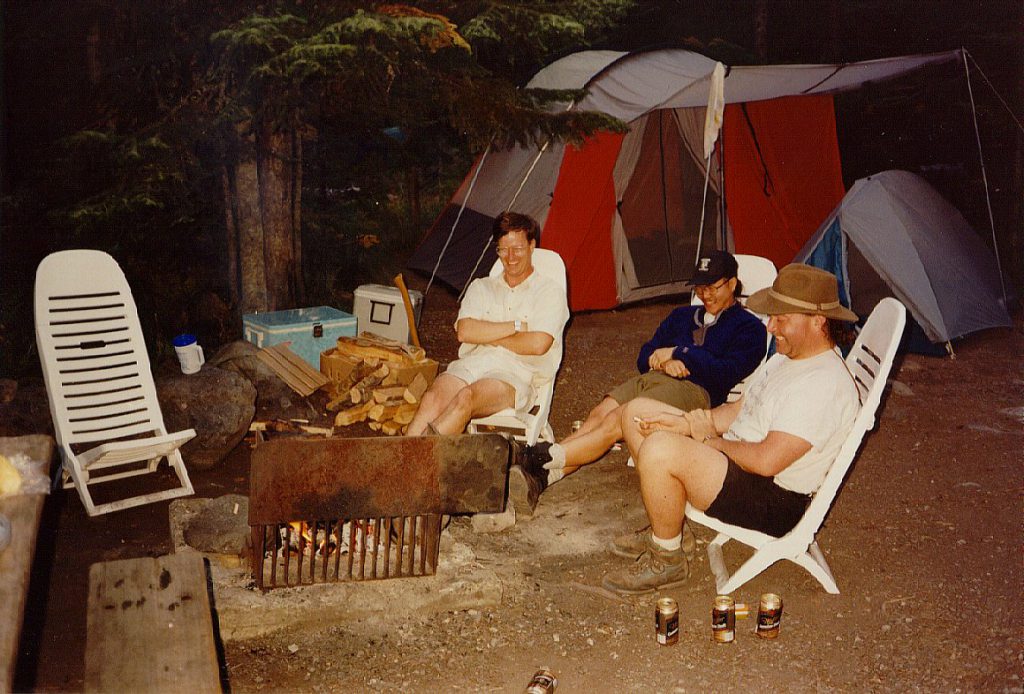 Of course, after any exercise comes the required beer fest. After festooning our campfire with dead soldiers we found something very funny. Strange though, no one can remember just *what* was so funny! Note the pile of firewood. The fellow who sold it to us did say it was a 'bit green' -- heck, it was less than 3 weeks since it was a nice big western cedar tree! It took a heck of a lot to get it burning but once it took it burned hot and long -- great for campfire cooking.
