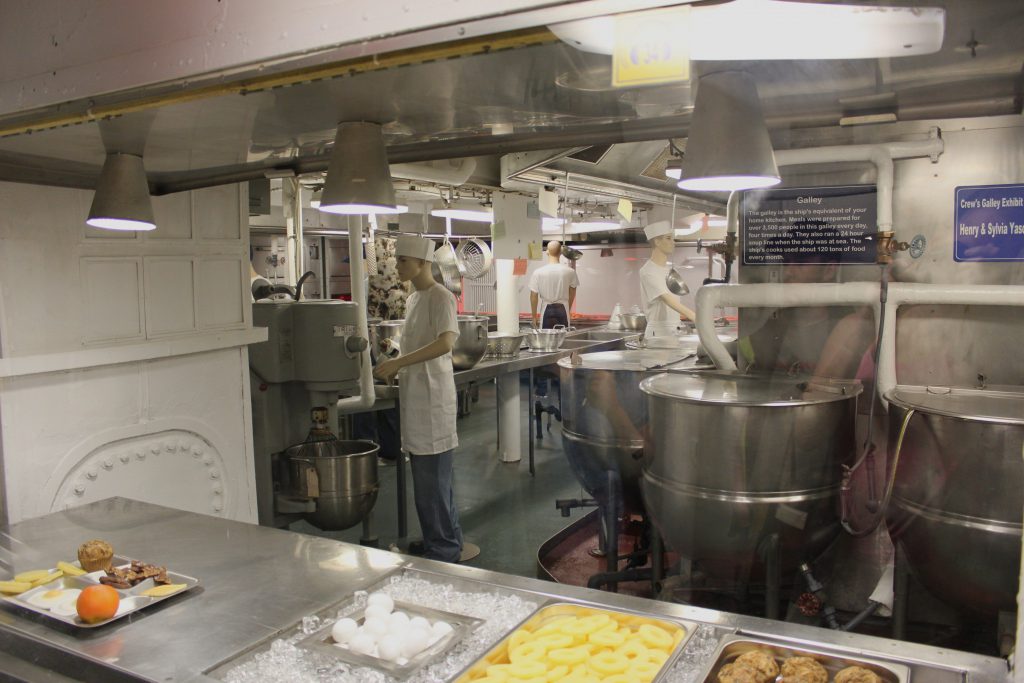 The galley and serving station in the foreground.