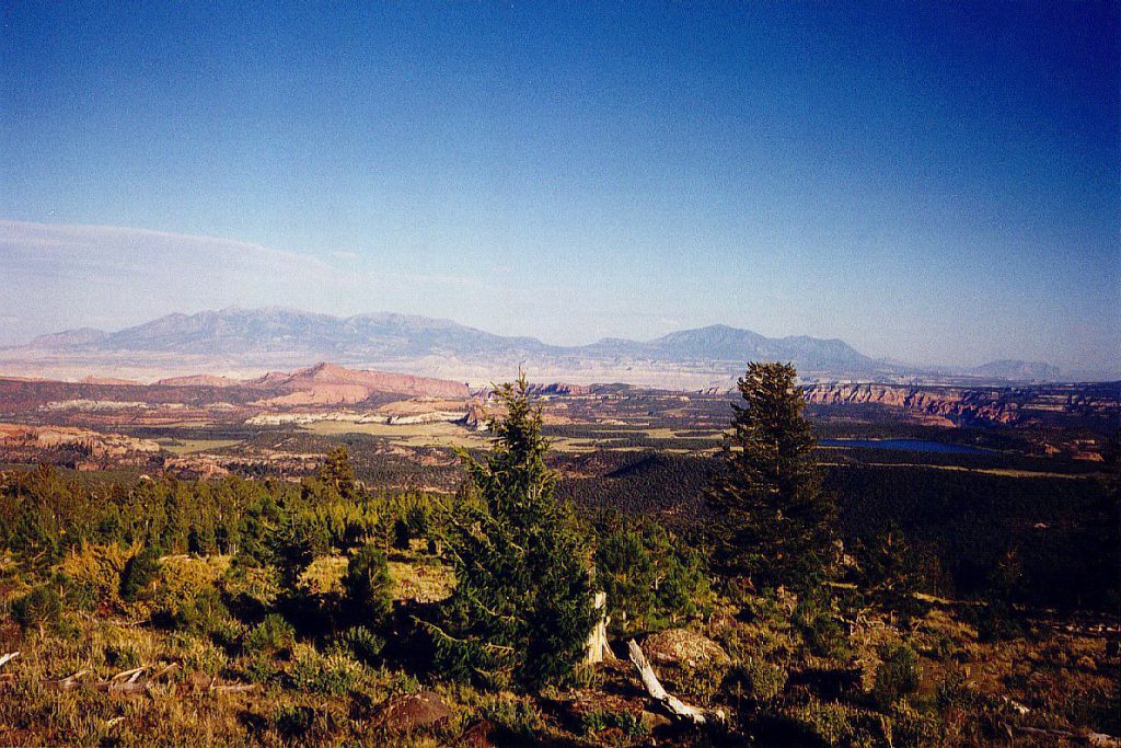 Looking north east from the Boulder Mountain you can see the setting sun light up the Capitol Reef on the left and the southward extension of the waterpocket fold on the right as well as the Henry Mountains in the distance.