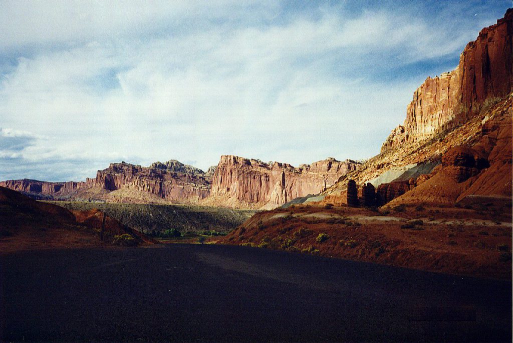 The Capitol Reef with the shadows cast by the setting sun and Boulder Mountain on the western horizon.