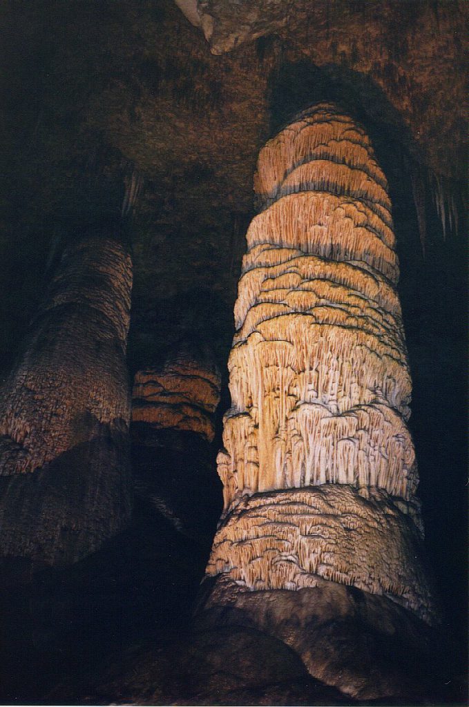 A beautifully illuminated giant stalagmite in the main cavern.