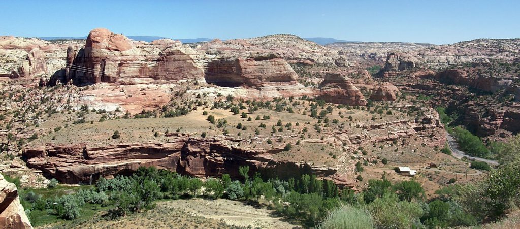 The valley of the Escalante River as it flows past the town of Bolder UT. Bolder is hidden in the valley just to the right of the picture, but you can make out some buildings and the electrical power lines run across the picture if you look carefully.