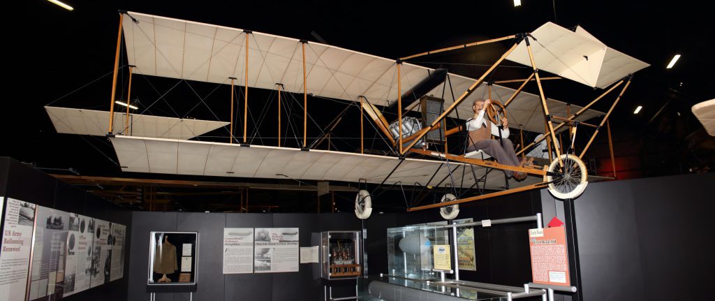 Early flight. Cloth wings and most of the air surfaces are backwards from a more modern plane.