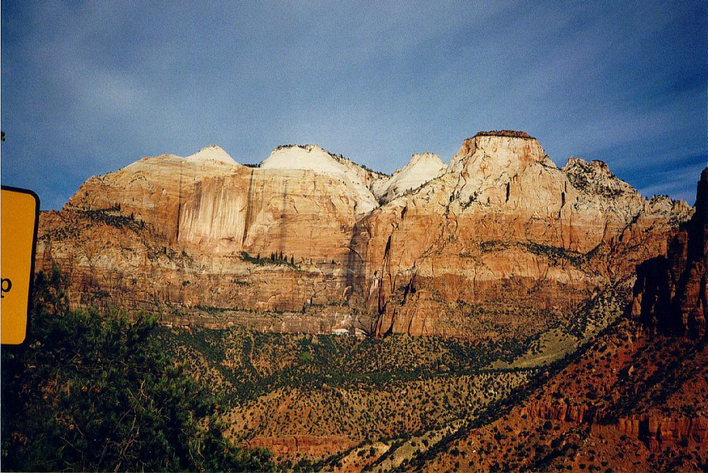 This photograph shows the sheer walls of Zion Canyon as you enter the park from the east. Rather than the limestone of Bryce, here the rock is sandstone and weathers much more robustly. The canyon is cut by the north and east forks of the Virgin River rather than just rainfall!